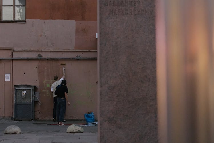 Men Painting Wall