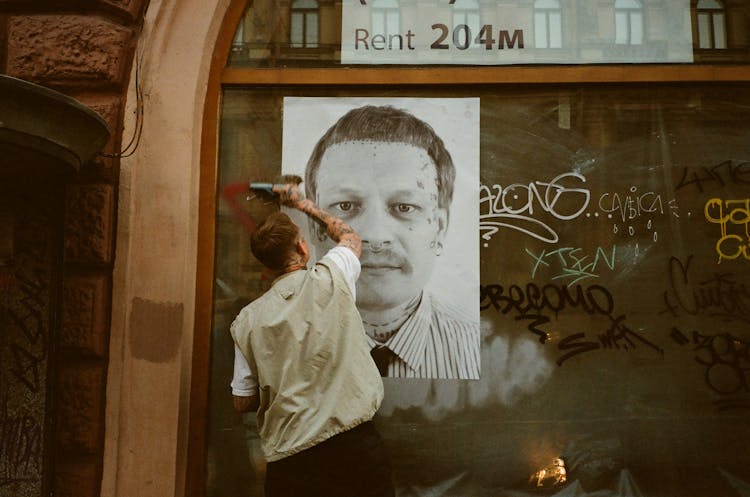 Man Wearing A Vest Posting A Picture Poster