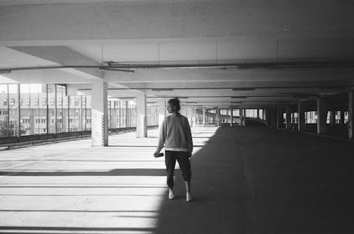 A Woman Standing while Looking Over Shoulder