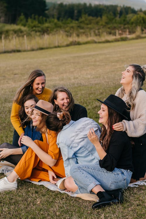 Free Laughing friends having fun on picnic Stock Photo