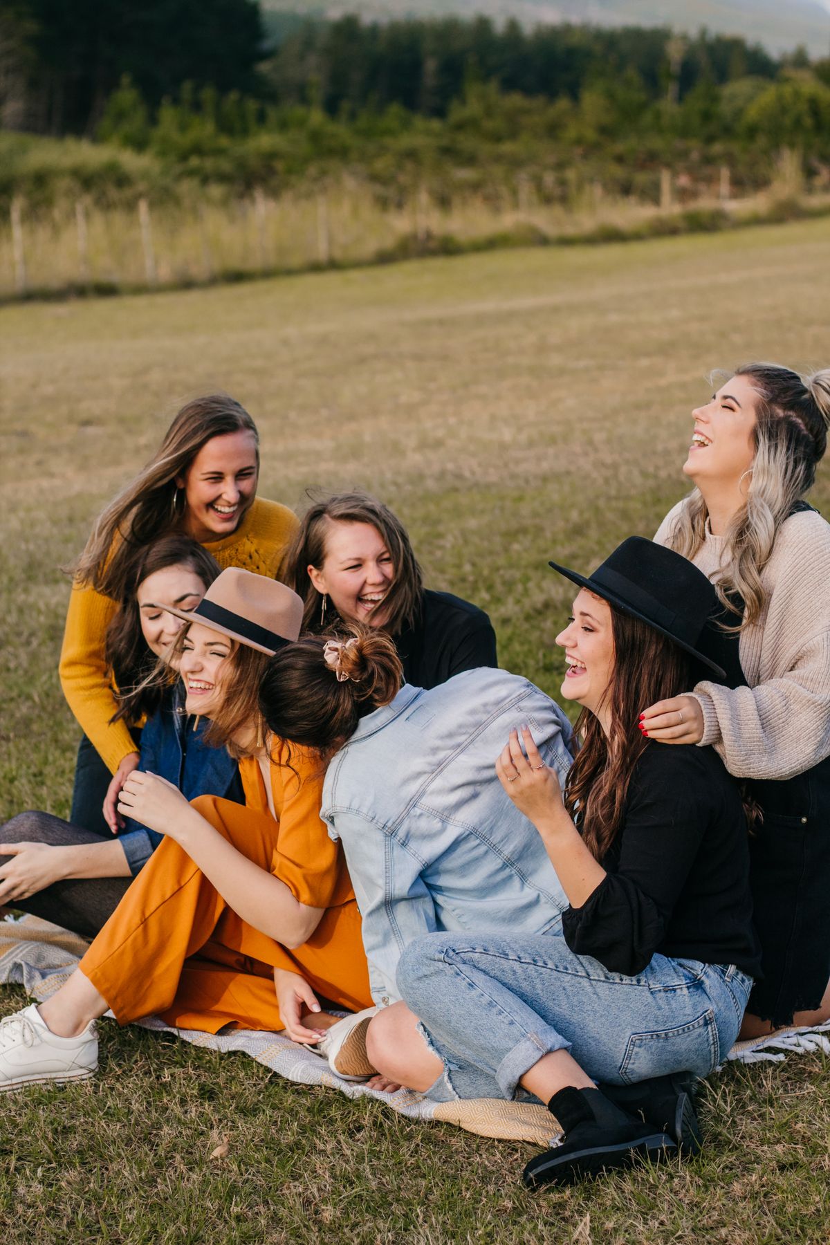 Had Bad Breath for Years? The Quiet Cost of a Lifetime of Hiding It 2 Friends laughing together outdoors, the closeness lost to a lifetime of hiding bad breath