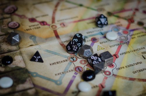 Free A vibrant board game scene featuring dice and a colorful map layout. Stock Photo