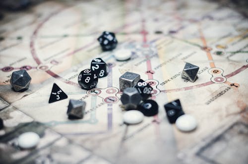 Free Black and Gray Dice on White Board Game  Stock Photo