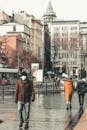 People Walking on Sidewalk Near Building