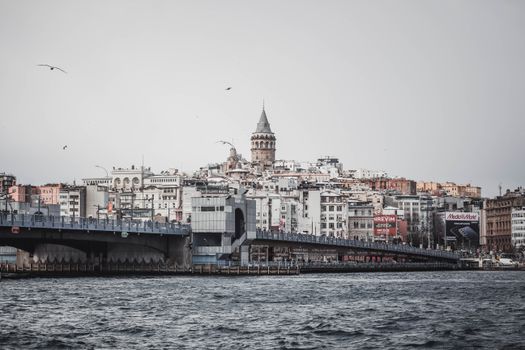 White and Brown Concrete Building Beside Body of Water