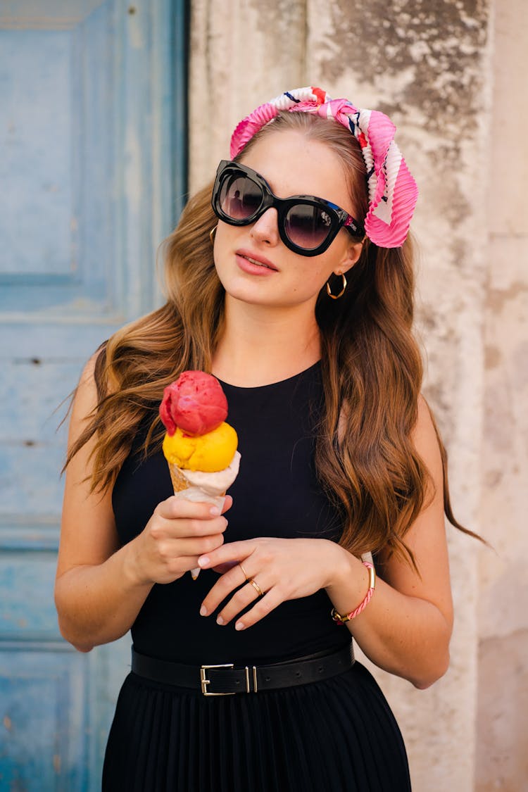 Pretty Woman Holding Ice Cream On Cone