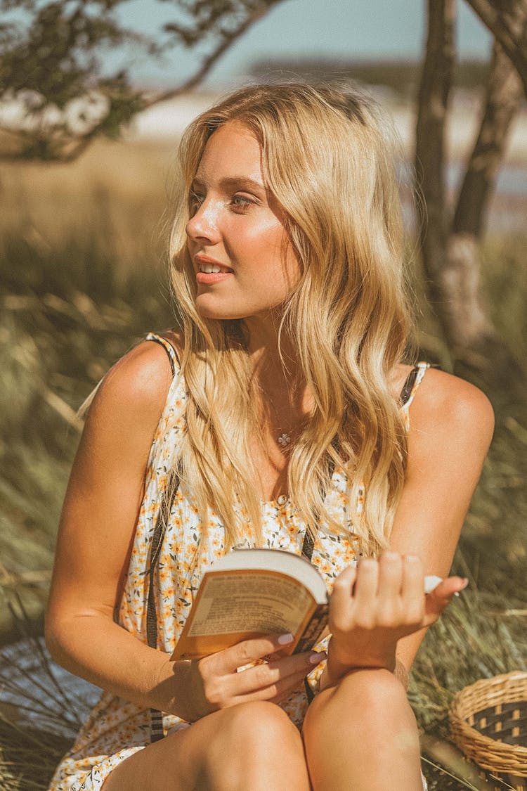 Woman Holding Pocket Book