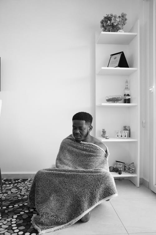 Free Monochrome Photo of a Man with a Blanket on His Body Stock Photo