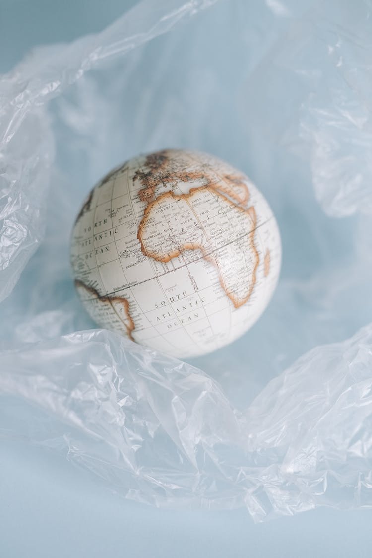 A Globe In A Clear Crumpled Plastic Sheet