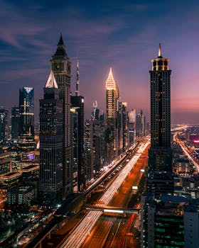 Discover the illuminated skyline of Dubai at night with light trails from motion.