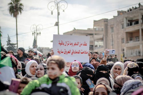 People holding Posters 