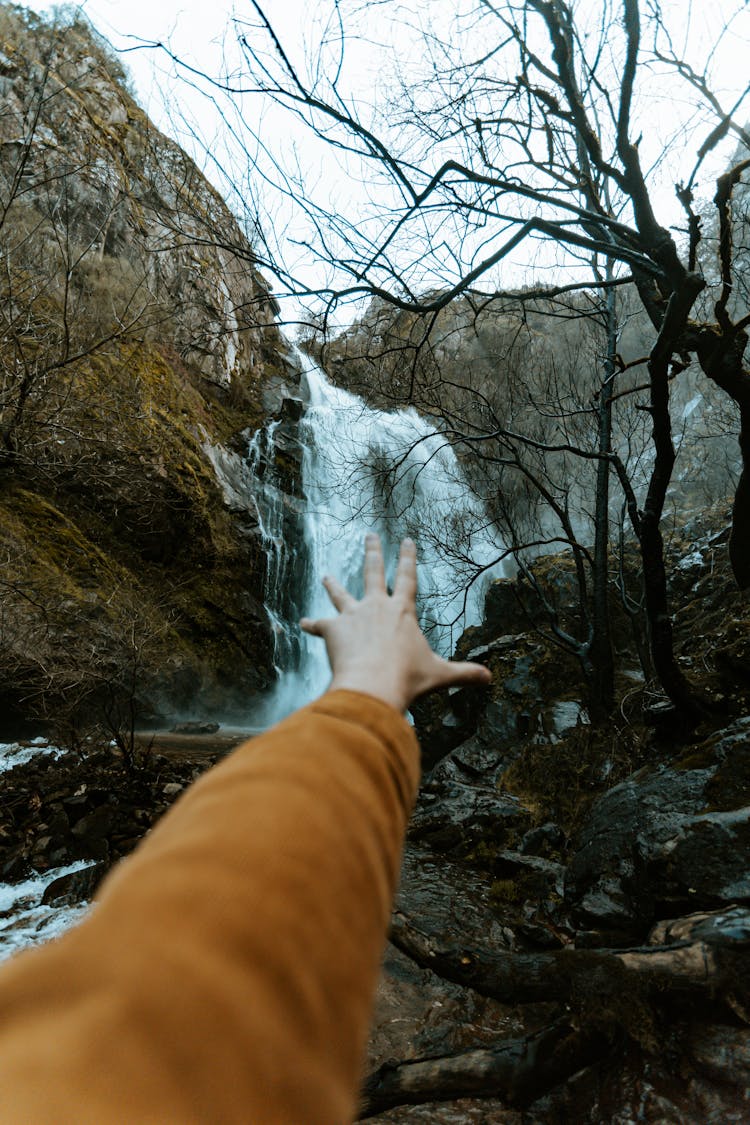 Hand Grabbing Waterfall