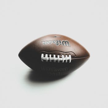 Close-up of a Wilson NFL football against a white backdrop, showcasing its texture.