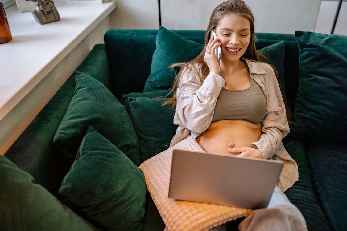 Free Pregnant Woman talking on Phone  Stock Photo