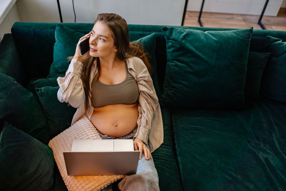 A concerned pregnant person on the phone with their doctor's office. - 17 weeks pregnant cramping A concerned pregnant person on the phone with their doctor's office. - 17 weeks pregnant cramping