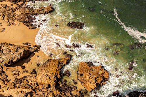 Waves crashing on Boulders 