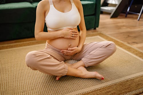 Free A Pregnant Woman Touching Her Baby Pump Stock Photo