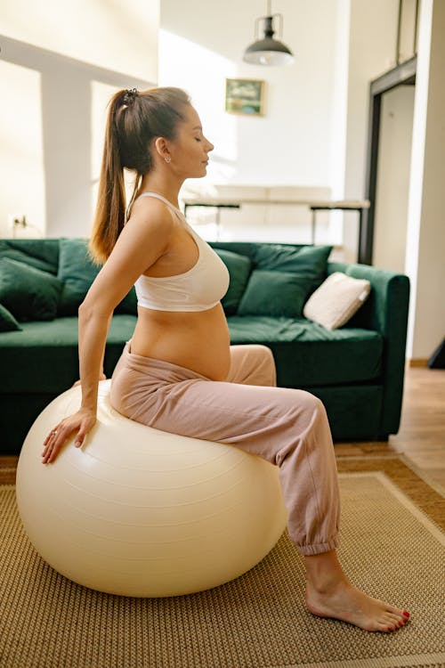 Free Pregnant Woman doing Excercise  Stock Photo