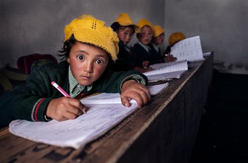 Children Writing in School