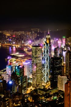 Stunning nighttime cityscape showcasing illuminated skyscrapers and vibrant urban life.