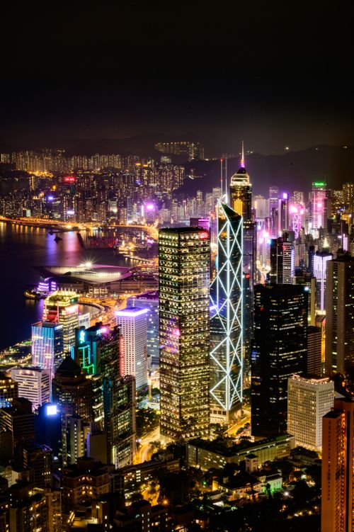 Free Stunning nighttime cityscape showcasing illuminated skyscrapers and vibrant urban life. Stock Photo