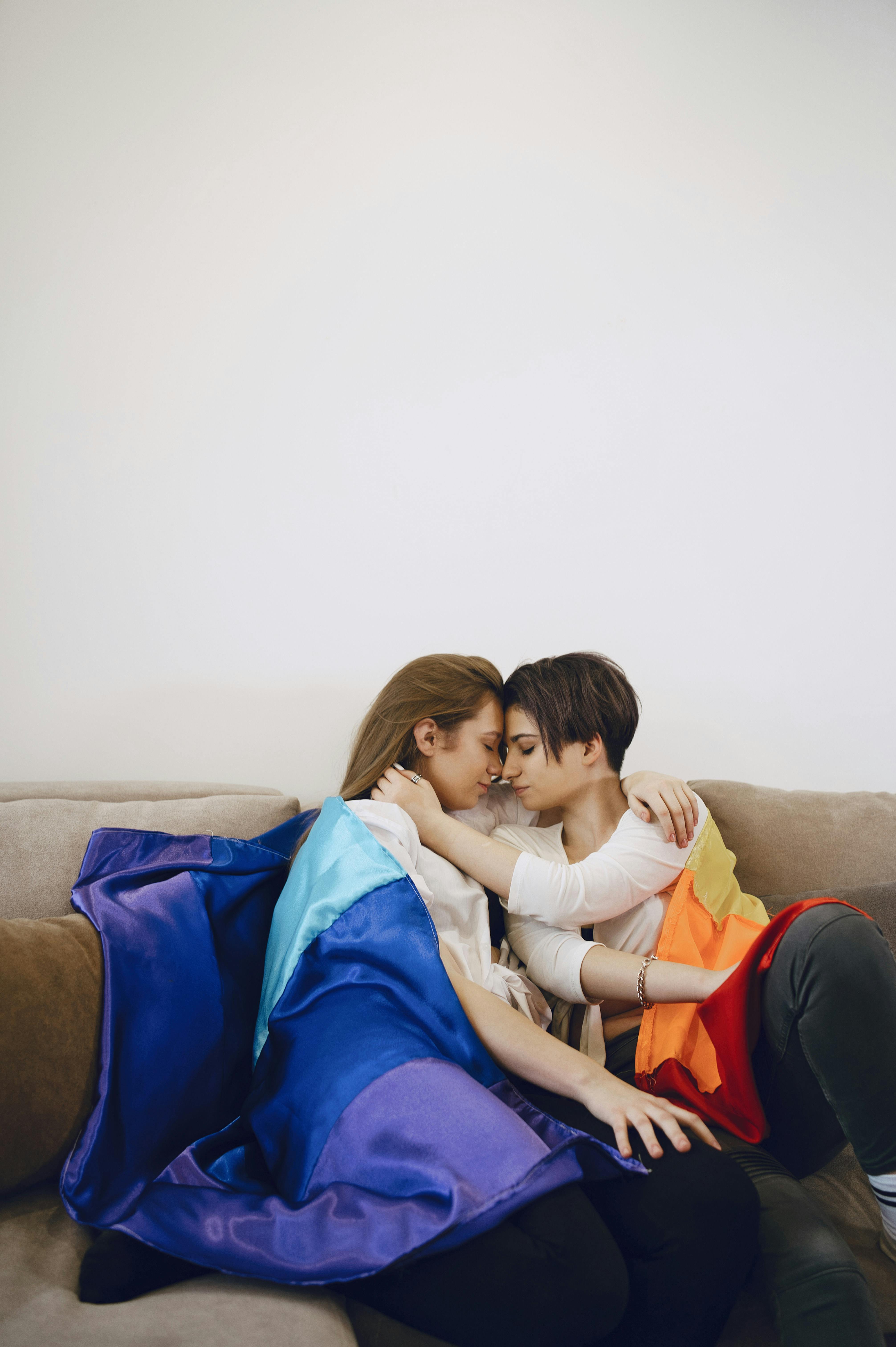 Intimate Couple sitting on a Sofa · Free Stock Photo