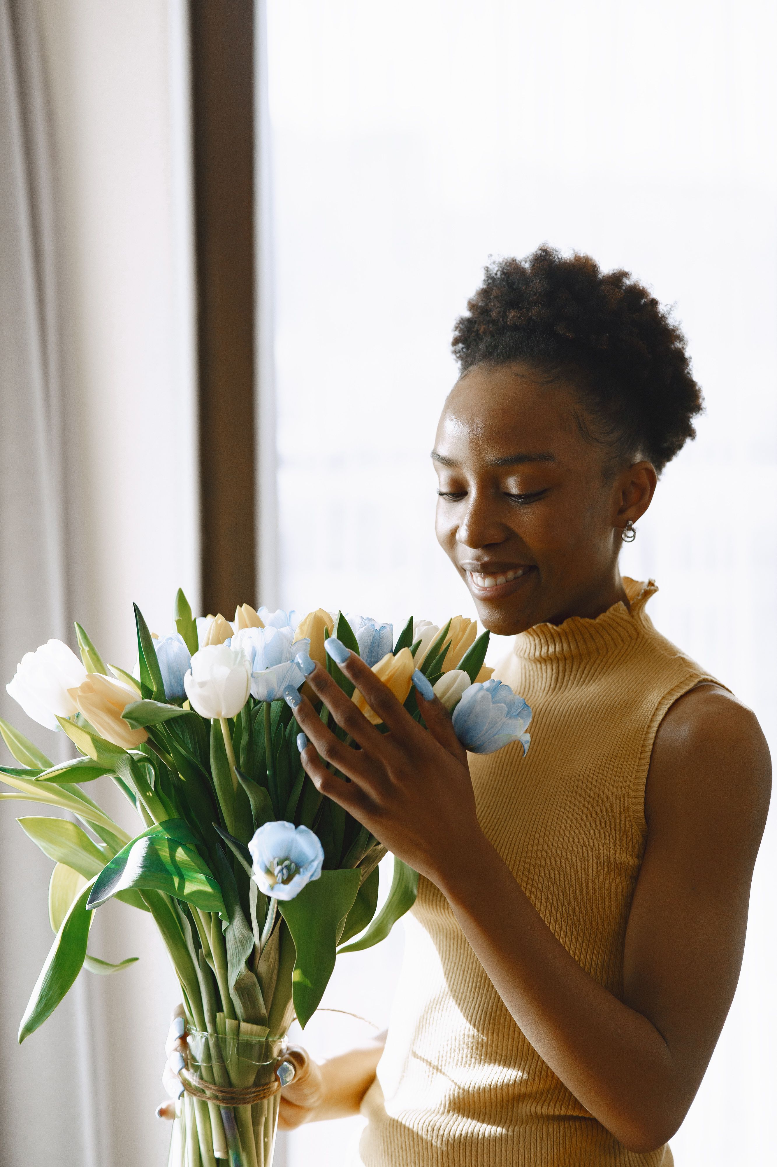 A Woman with a Bouquet of Flowers · Free Stock Photo