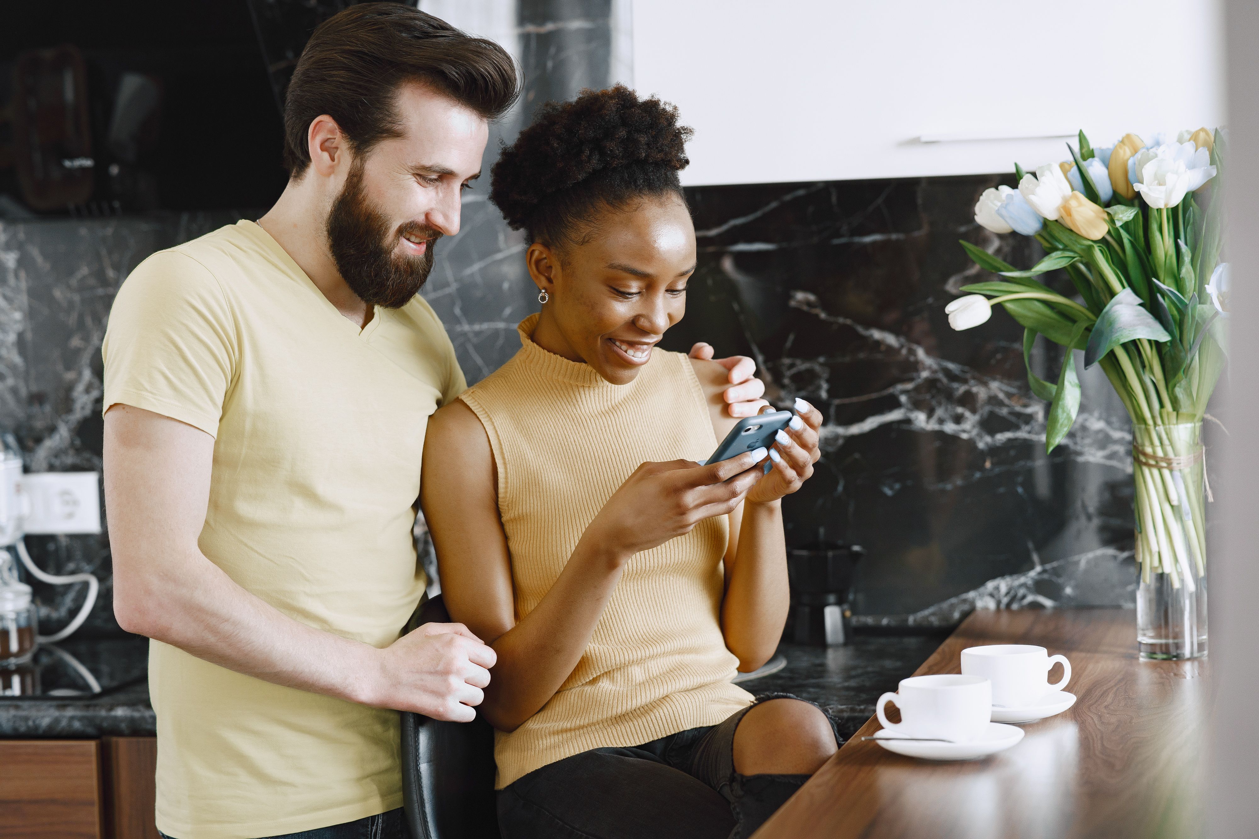 couple looking at phone sharing wifi network together
