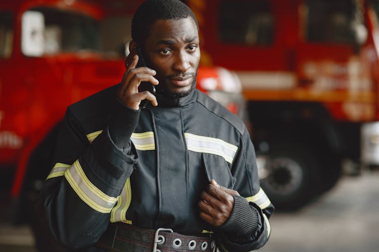 Close-up Photo Of A Fireman Talking On Phone