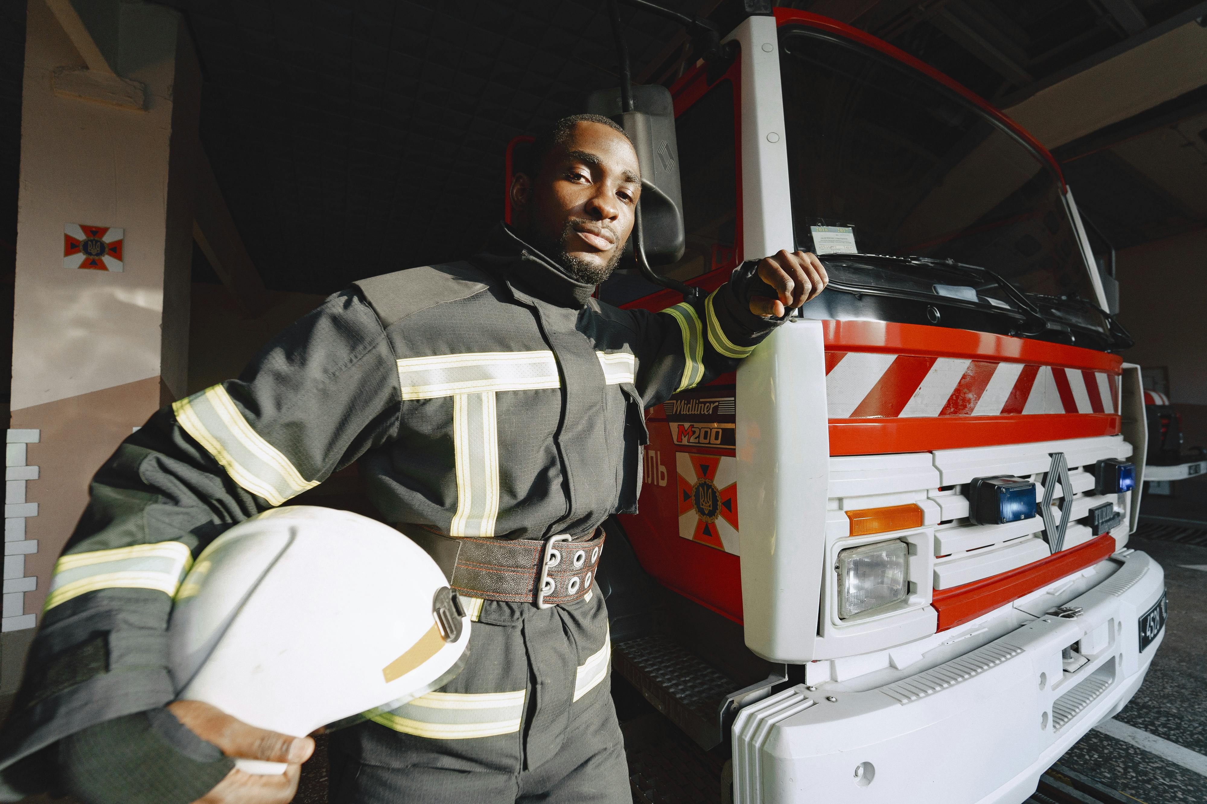 firefighter posing with his truck