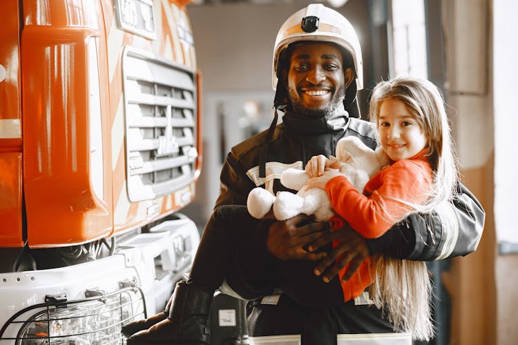 Fireman Carrying A Cute Girl 