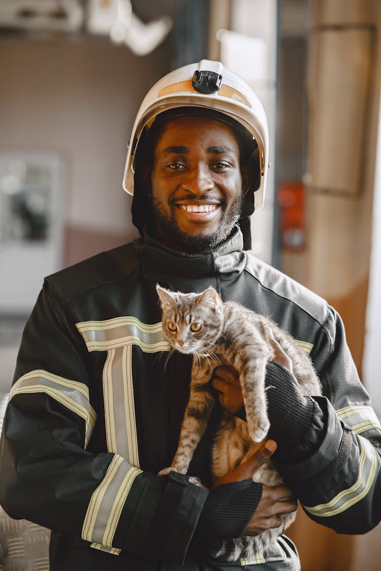 Fireman Carrying A Cute Cat 