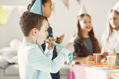 Boy blowing up a Balloon 