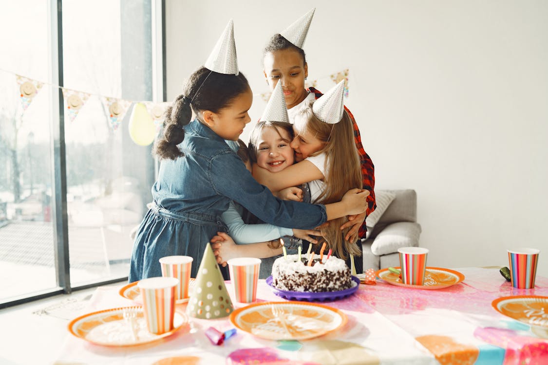 Free Kids Standing Near the Table Stock Photo