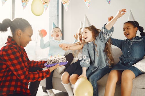 Free Kids Sitting on the Couch Stock Photo