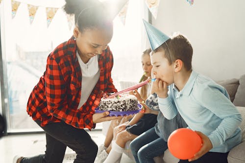 Boy playing with a Cake 