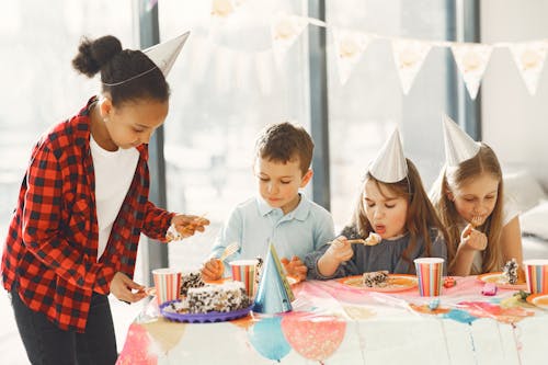 Children eating Cake on a Birthday Party 