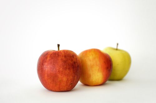 Free Three crisp apples in different colors against a white backdrop, showcasing fresh and healthy fruit. Stock Photo
