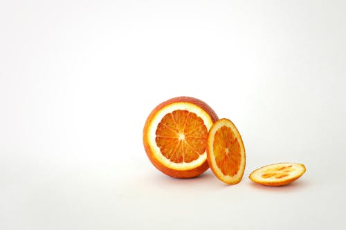 Sliced Orange on White Surface 