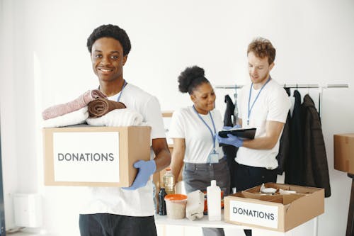 Free Group pf People Packing Items for Donation Stock Photo