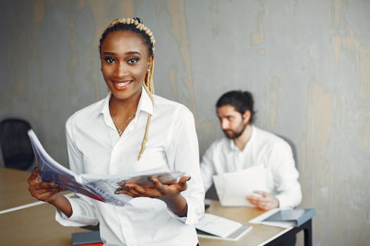 Smiling professionals in a modern office, showcasing diversity and collaboration.