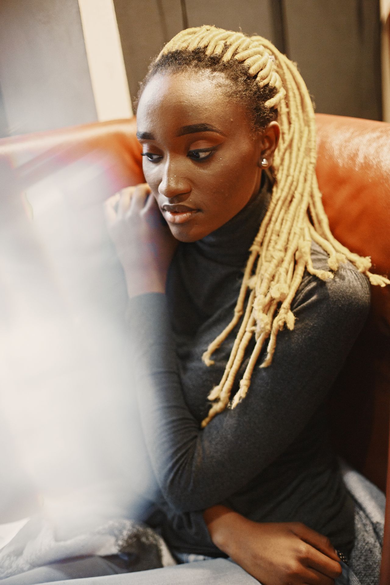 Woman wearing a dark fitted turtleneck sweater