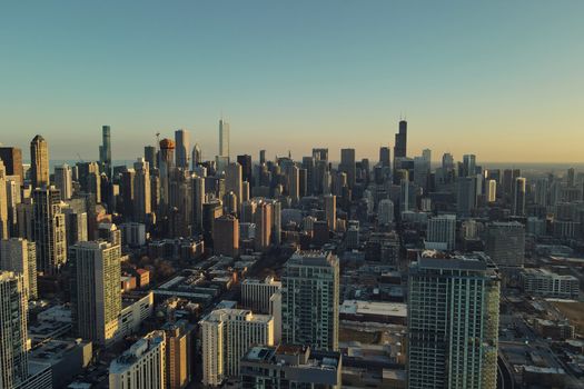 Breathtaking aerial view of Chicago's skyline during sunset, showcasing its iconic skyscrapers.