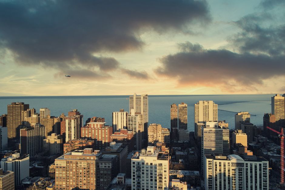 Incredible Sunset Helicopter Experience in Downtown Detroit Review: The Ultimate Guide to Michigan's Most Breathtaking Aerial Adventure Review 2026 - Stunning aerial view of Chicago buildings with Lake Michigan during sunset, clouds enhancing city charm.