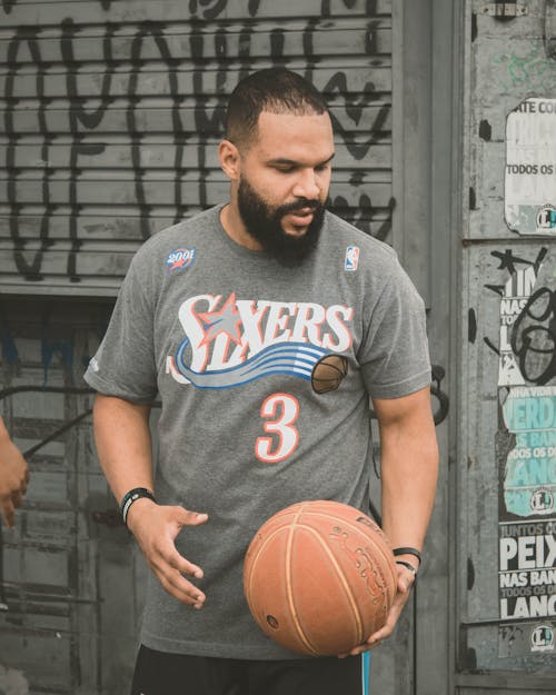 A Bearded Man Holding a Basketball