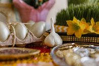 A vibrant Haft Sin table setup with symbolic items for Nowruz celebration.