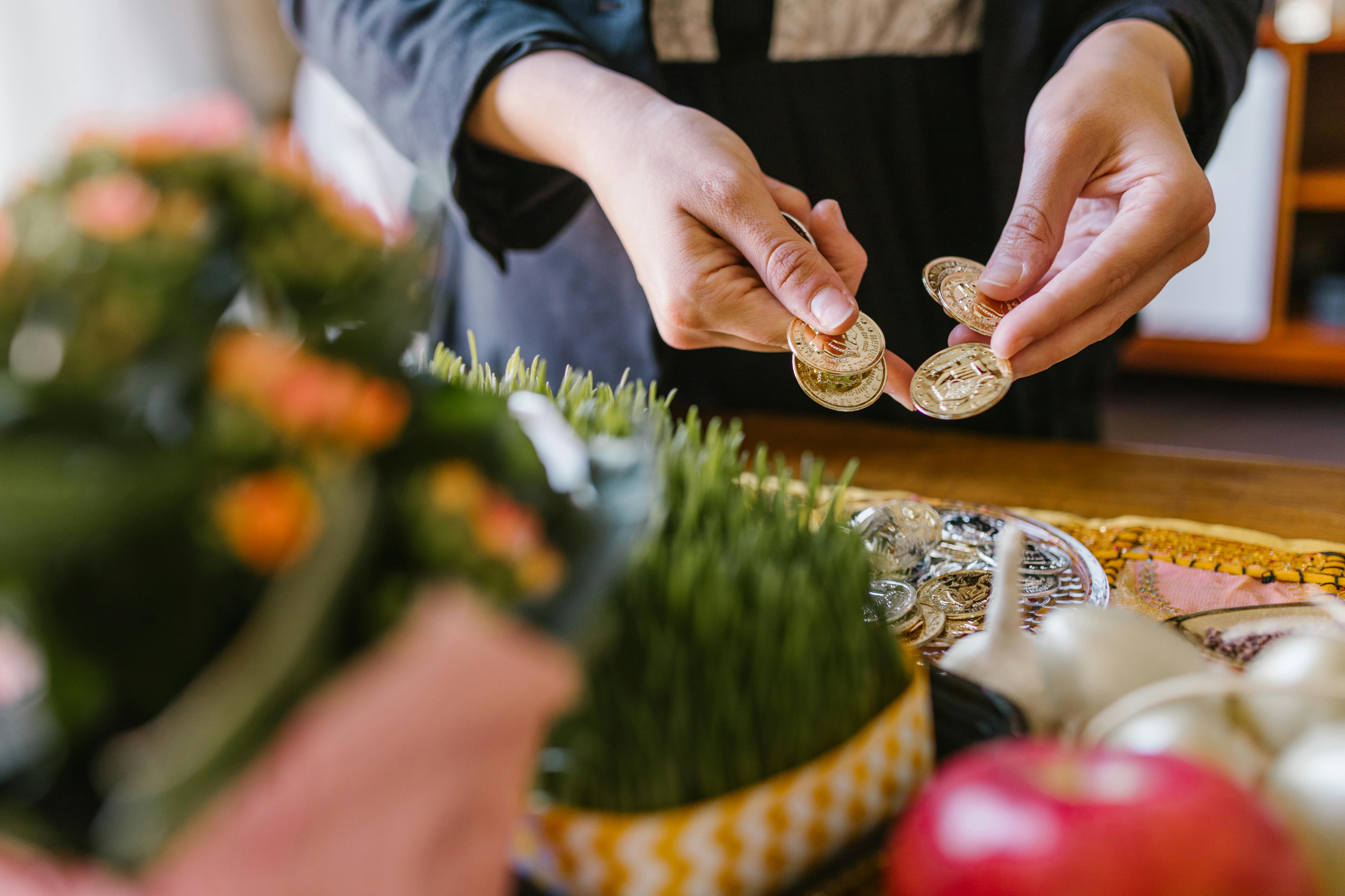 person holding golden coins