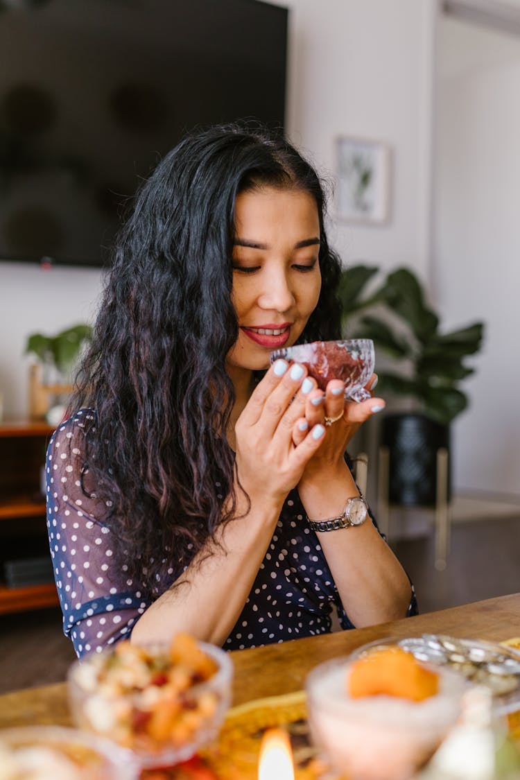 Woman Holding A Glass Bowl