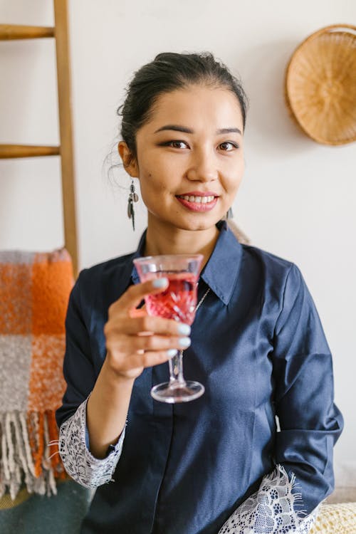 Woman Holding A Glass Of Wine