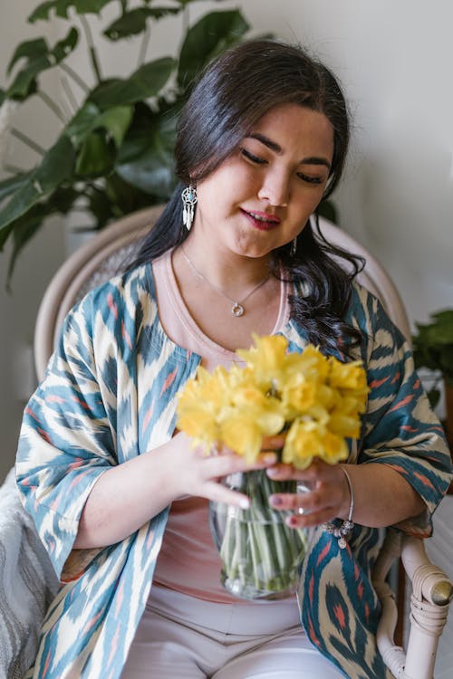 Woman Holding A Bunch Of Yellow Flowers